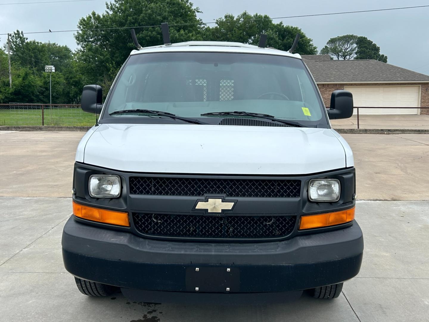 2014 White /Gray Chevrolet Express (1GCWGFCB5E1) , AUTOMATIC transmission, located at 17760 Hwy 62, Morris, OK, 74445, (918) 733-4887, 35.609104, -95.877060 - 2014 CHEVROLET EXPRESS CARGO VAN 6.0L V8 RWD FEATURING POWER LOCKS, POWER WINDOWS, MANUAL MIRRORS, MANUAL SEATS, AM/FM STEREO, LEATHER SEATS, LEATHER-WRAPPED STEERING WHEEL, TRACTION CONTROL, LOCKING METAL CONSOLE, STEEL SHELVES, SPLIT SWING-OUT RIGHT DOORS, AND TOW PACKAGE. EQUIPPED WITH A CNG FUE - Photo#1